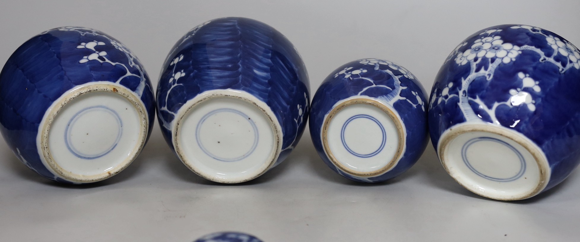 Four Chinese blue and white prunus pattern ginger jars, together with three similar vases. 19th/early 20th century, Tallest 15cm